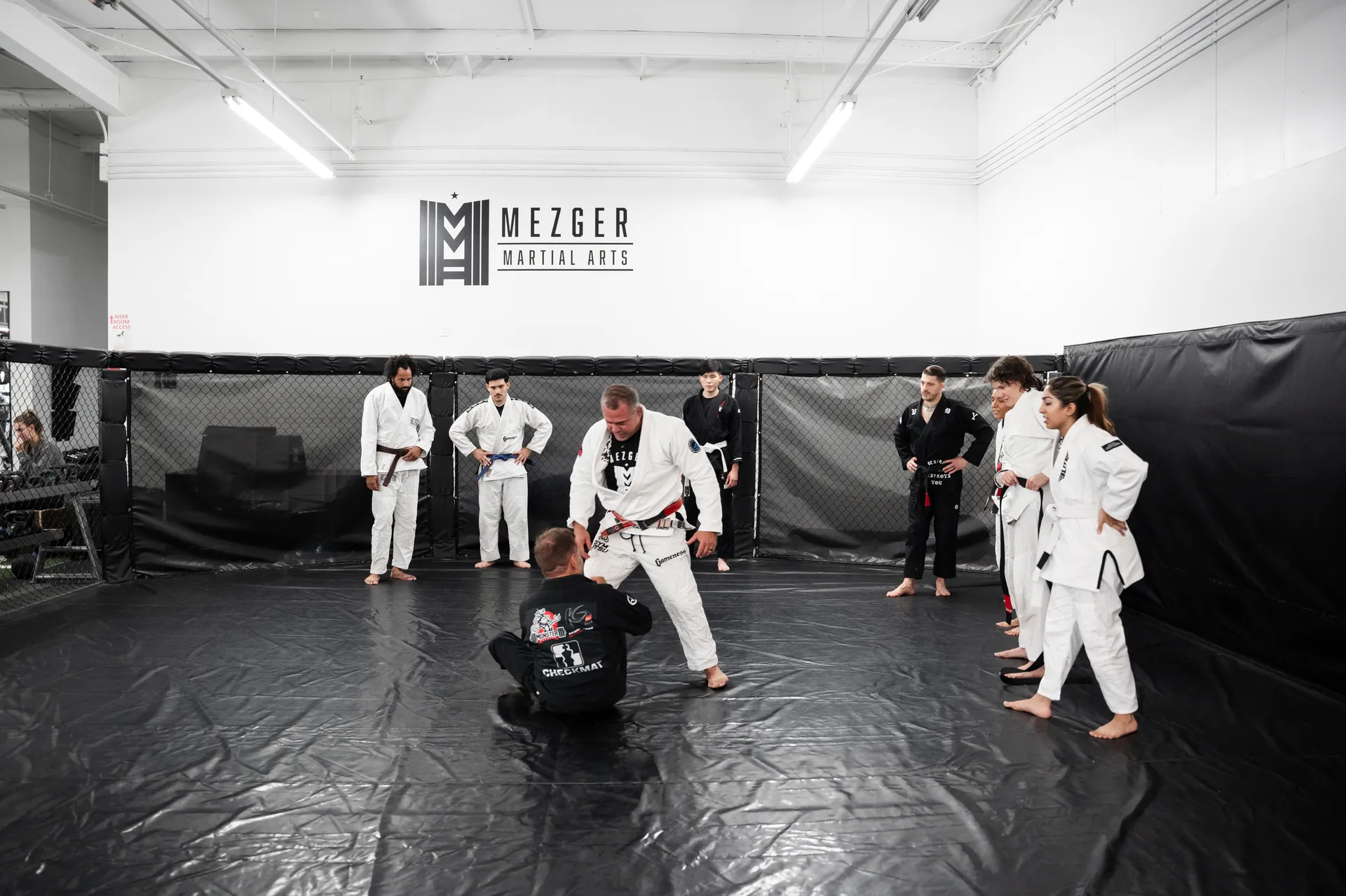 Brazilian Jiu-Jitsu class lined up on the mats at Mezger Martial Arts