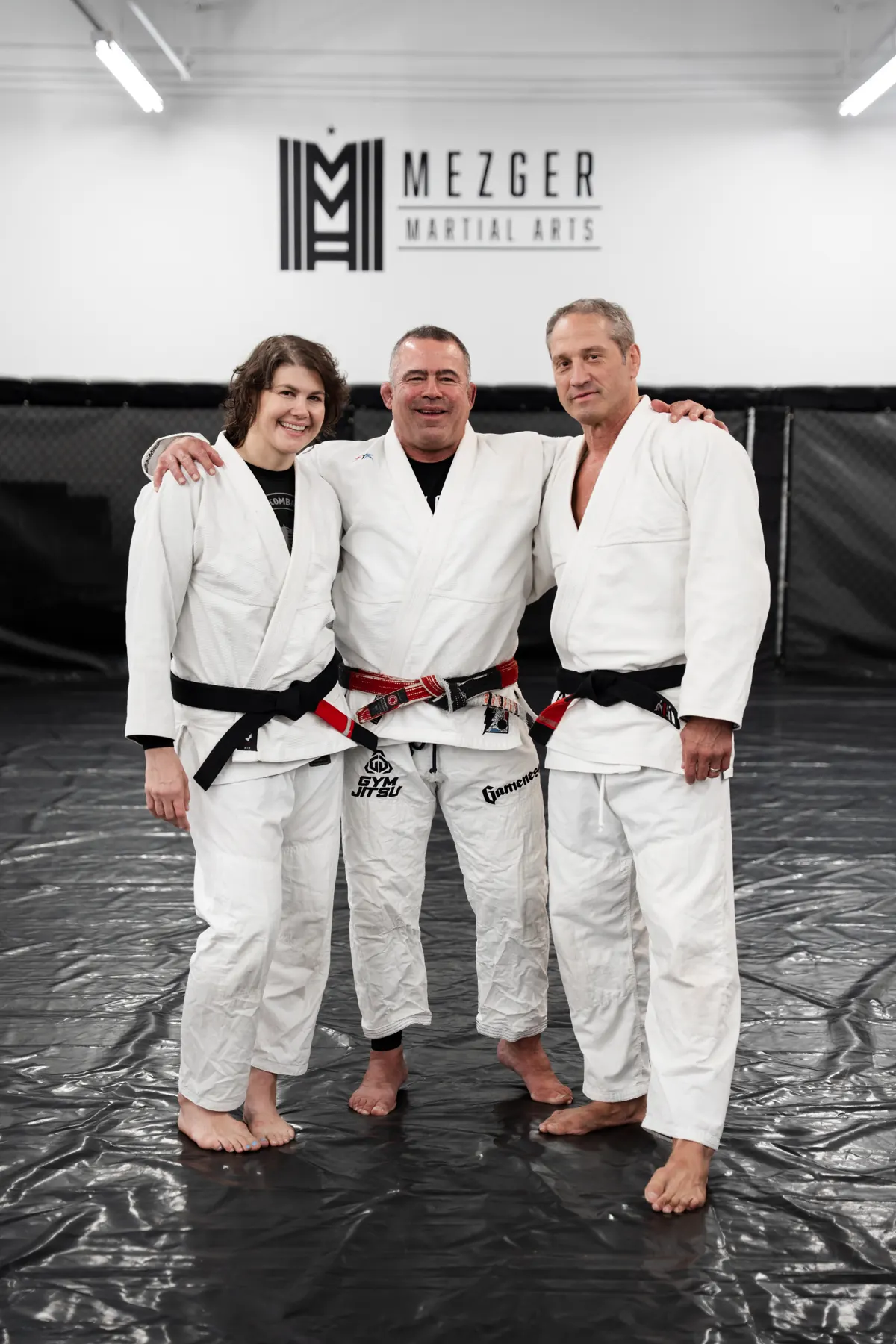 Training partners in gis on the mats at Mezger Martial Arts