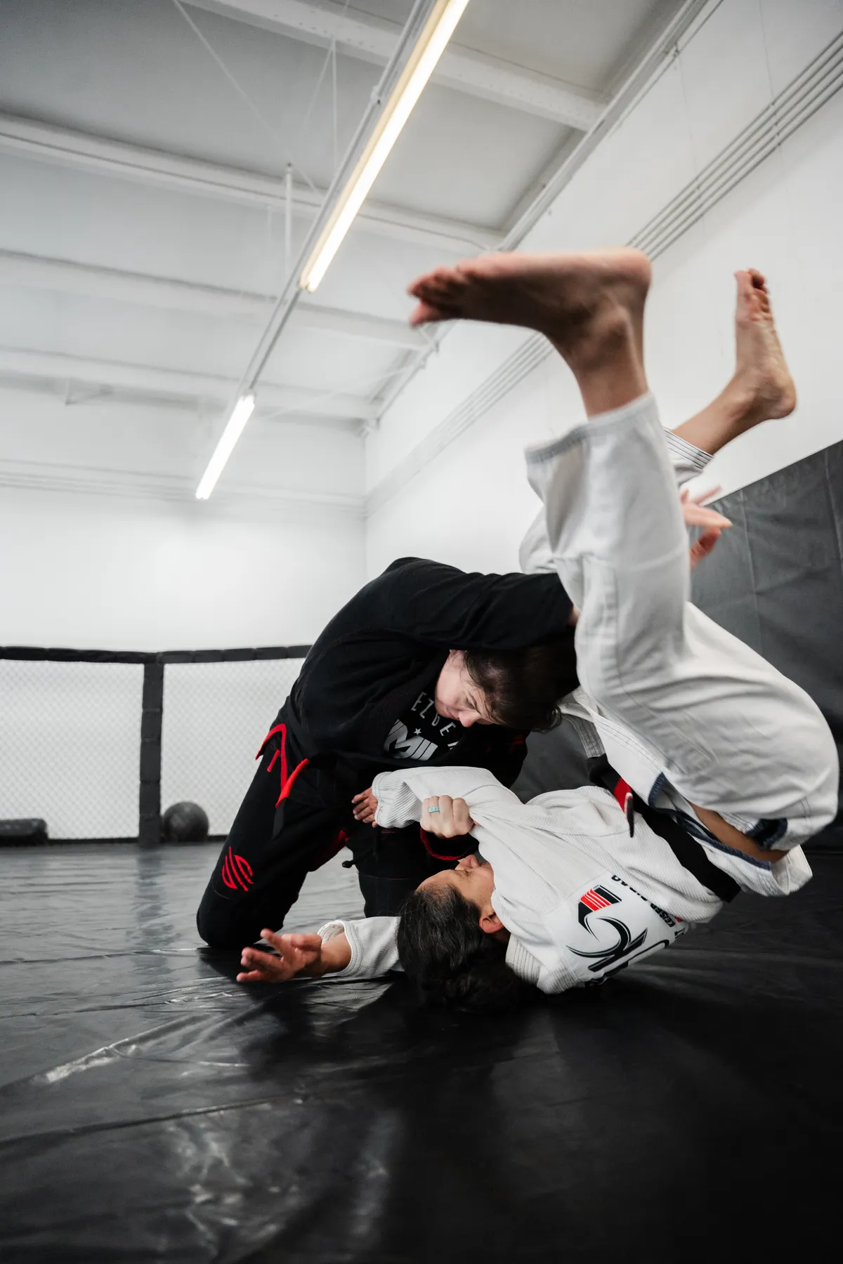 Gi throw during Brazilian Jiu-Jitsu training at Mezger Martial Arts